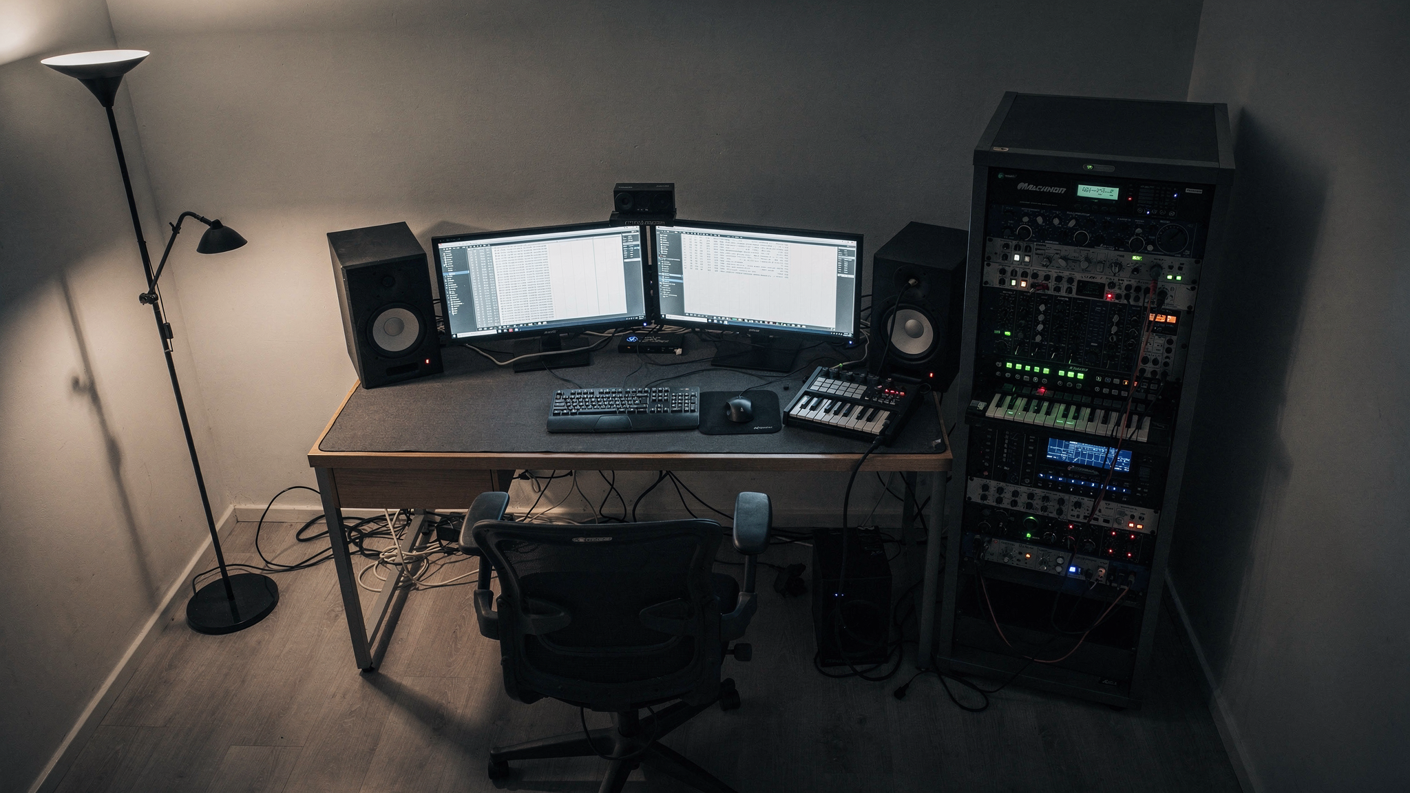 Overhead view of a home studio desk with uneven distances to each side wall